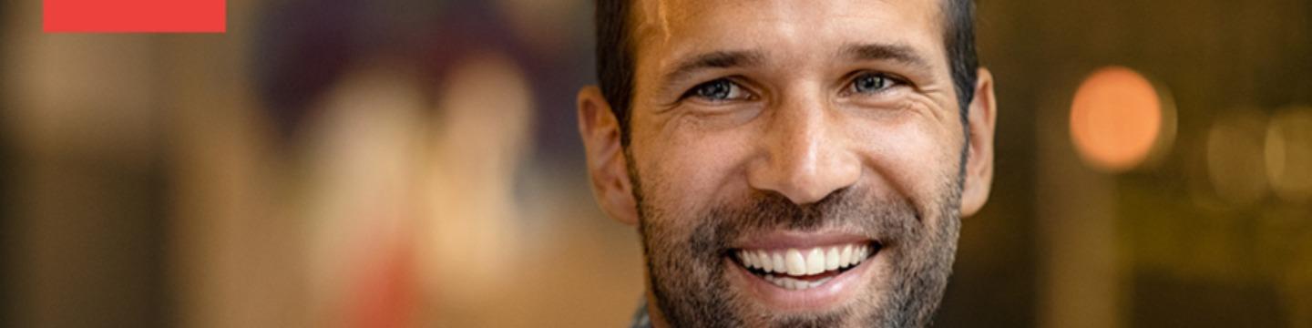 wide banner of smiling man